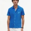 Polo de rizo con monograma en letra cursiva
