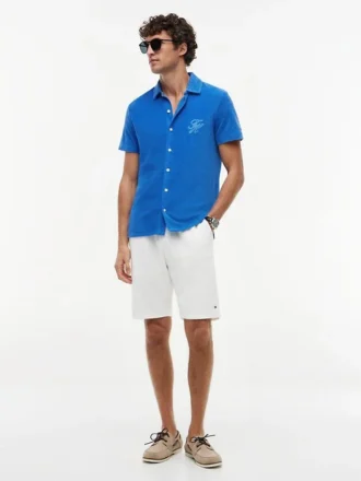 Polo de rizo con monograma en letra cursiva