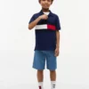 Polo elástico con bandera y bloques de color para niño Polo elástico con bandera y bloques de color para niño