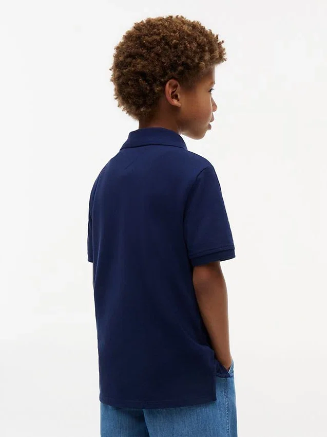 Polo elástico con bandera y bloques de color para niño Polo elástico con bandera y bloques de color para niño