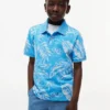 Polo elástico con estampado tropical para niño