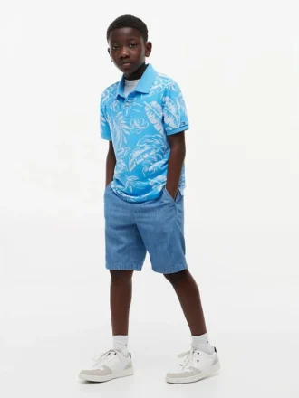Polo elástico con estampado tropical para niño