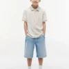 Polo elástico con estampado tropical para niño