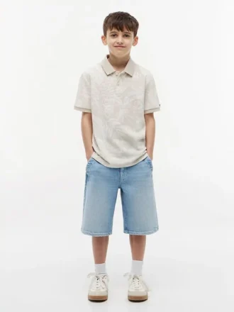Polo elástico con estampado tropical para niño