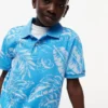 Polo elástico con estampado tropical para niño