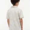 Polo elástico con estampado tropical para niño