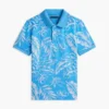 Polo elástico con estampado tropical para niño