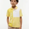 Polo elástico con logo y bloques de color para niño Polo elástico con logo y bloques de color para niño