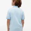 Polo elástico con logo y bloques de color para niño Polo elástico con logo y bloques de color para niño