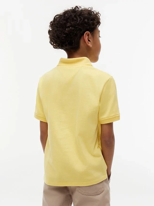 Polo elástico con logo y bloques de color para niño Polo elástico con logo y bloques de color para niño