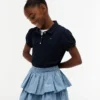 Polo elástico con mangas abullonadas para niña Polo elástico con mangas abullonadas para niña