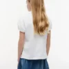 Polo elástico con mangas abullonadas para niña Polo elástico con mangas abullonadas para niña