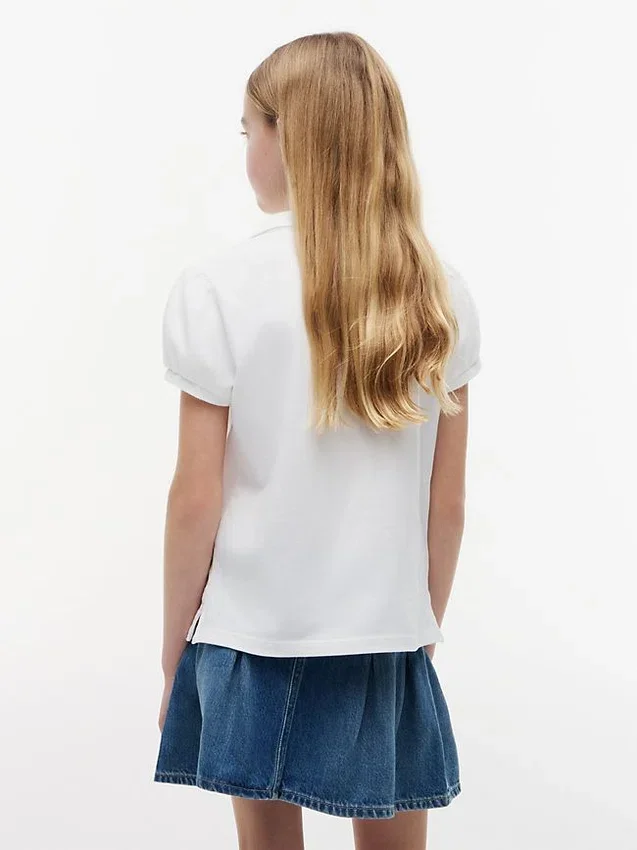 Polo elástico con mangas abullonadas para niña Polo elástico con mangas abullonadas para niña