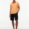 Polo Tommy de corte regular elástico