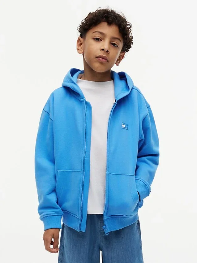 Sudadera con capucha y cremallera para niño con bandera en tonos Sudadera con capucha y cremallera para niño con bandera en tonos