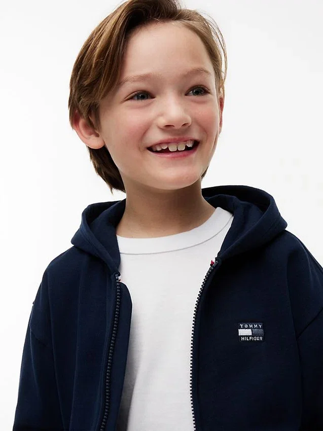 Sudadera con capucha y cremallera para niño con bandera en tonos Sudadera con capucha y cremallera para niño con bandera en tonos