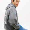 Sudadera con capucha y logotipo pintado con spray de Tommy Jeans