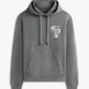 Sudadera con capucha y logotipo pintado con spray de Tommy Jeans