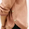 Sudadera de punto interlock con botones dorados