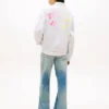 Sudadera holgada con estampado de pompones de Tommy Jeans