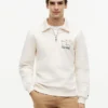Sudadera polo con logo floral y cremallera de un cuarto