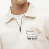 Sudadera polo con logo floral y cremallera de un cuarto