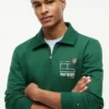 Sudadera polo con logo floral y cremallera de un cuarto Sudadera polo con logo floral y cremallera de un cuarto