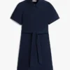 Vestido camisero con cinturón y mangas abullonadas
