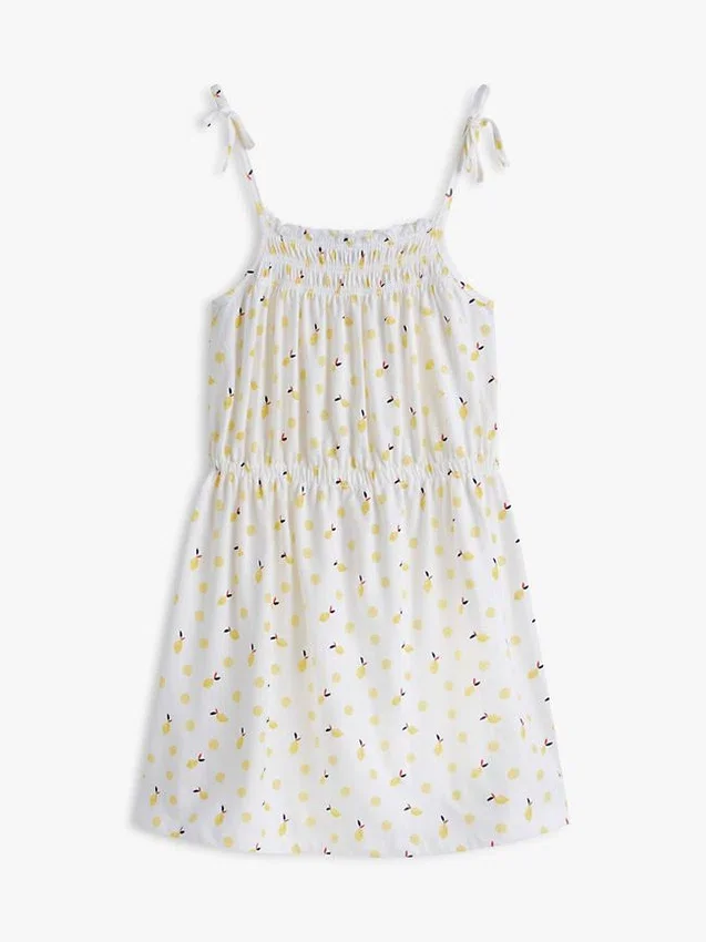 Vestido de niña con estampado de limones y fruncidos Vestido de niña con estampado de limones y fruncidos