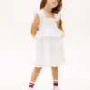 Vestido infantil con volantes y ojales bordados Vestido infantil con volantes y ojales bordados