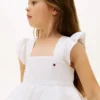 Vestido infantil con volantes y ojales bordados Vestido infantil con volantes y ojales bordados