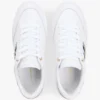 Zapatillas con suela de goma y rayas de cinta Zapatillas con suela de goma y rayas de cinta