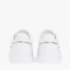 Zapatillas con suela de goma y rayas de cinta Zapatillas con suela de goma y rayas de cinta